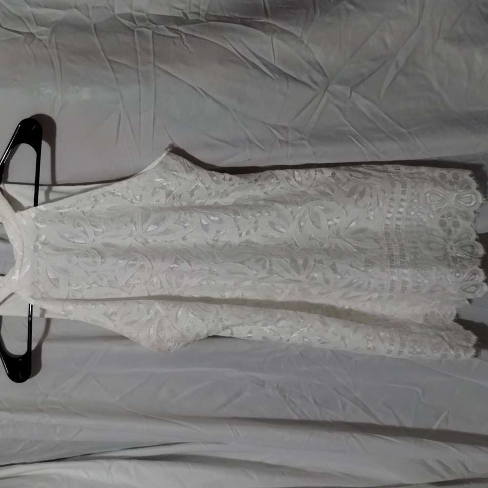 White lace overlay dress fully lined gently used. Size small.
